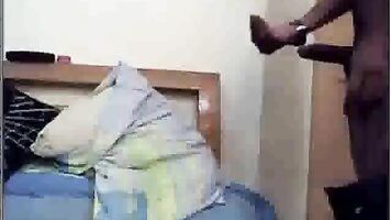 Indian girl performing a belly dance for her room mates shaking her belly