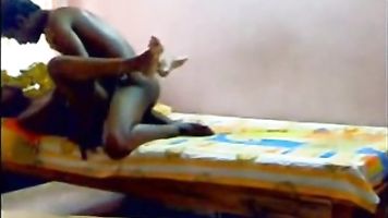 Hot South Indian couple enjoying sex in their bedroom.